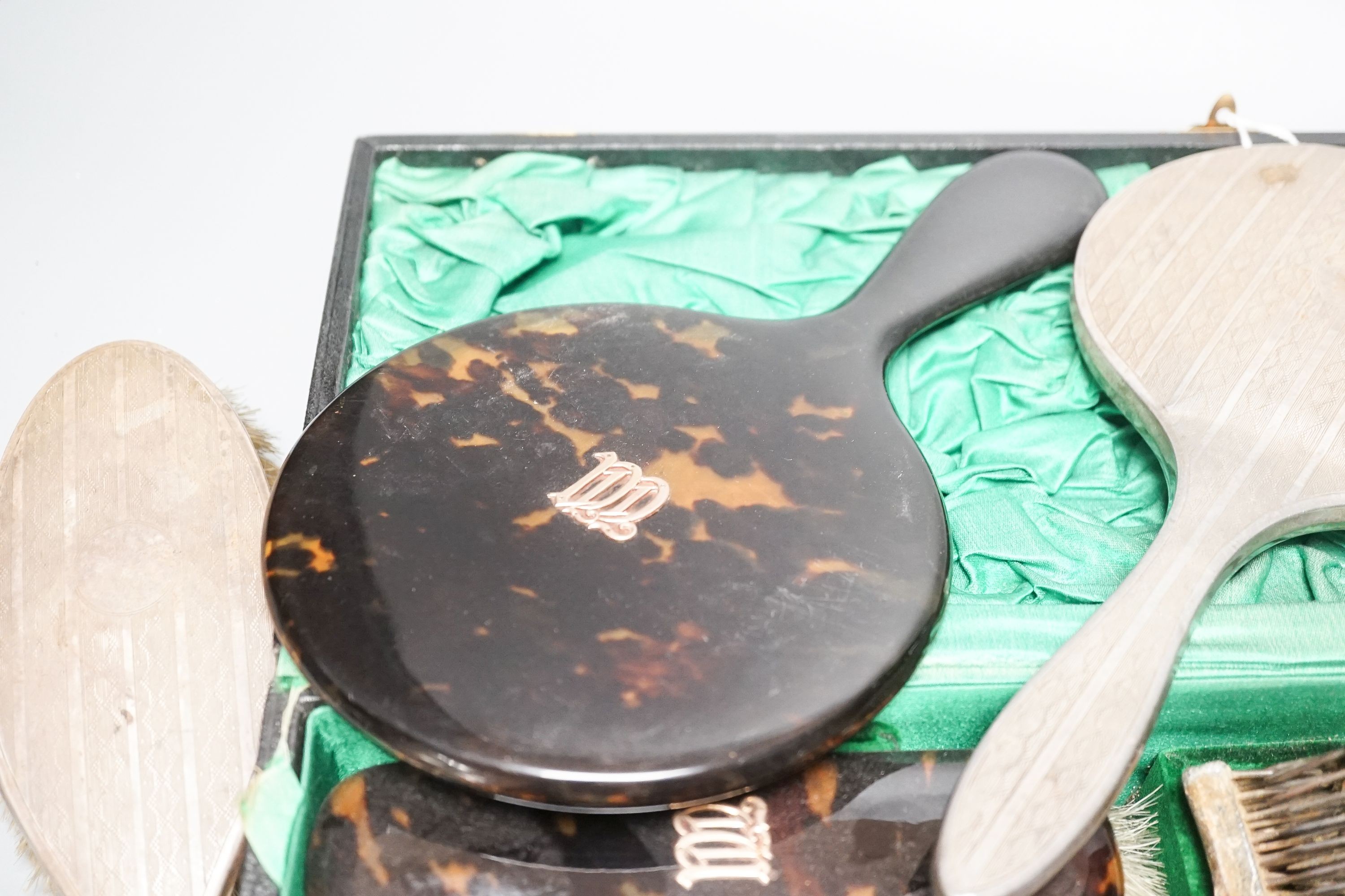 A tortoiseshell toilet set and silver dressing table items